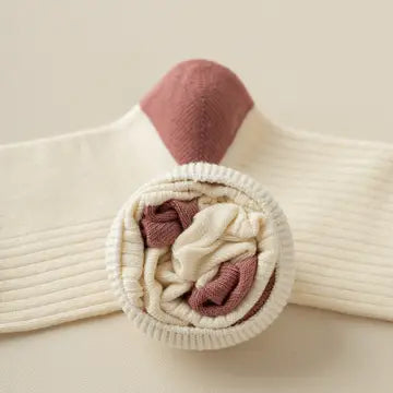 Rolled cream cotton sock with burgundy toe and retro stripe details – styled flat on a beige background