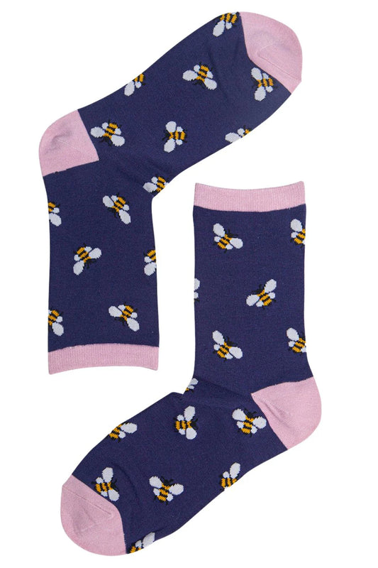 Pair of women’s bamboo socks with bee design, navy blue and pink detail