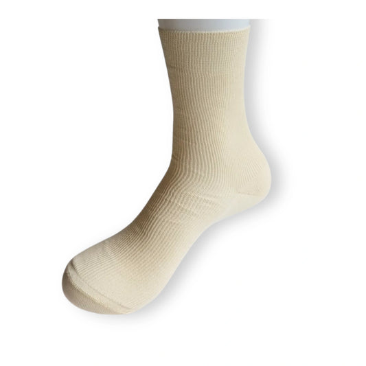 Laura organic cotton sock in undyed cream on mannequin leg