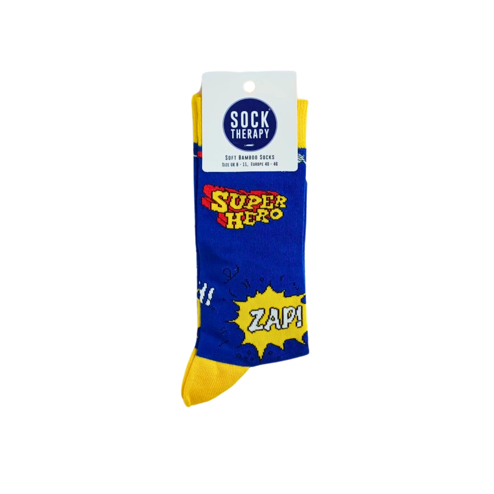 Super Hero bamboo sock in blue with yellow accents and comic print, shown in Sock Therapy packaging on a white background.
