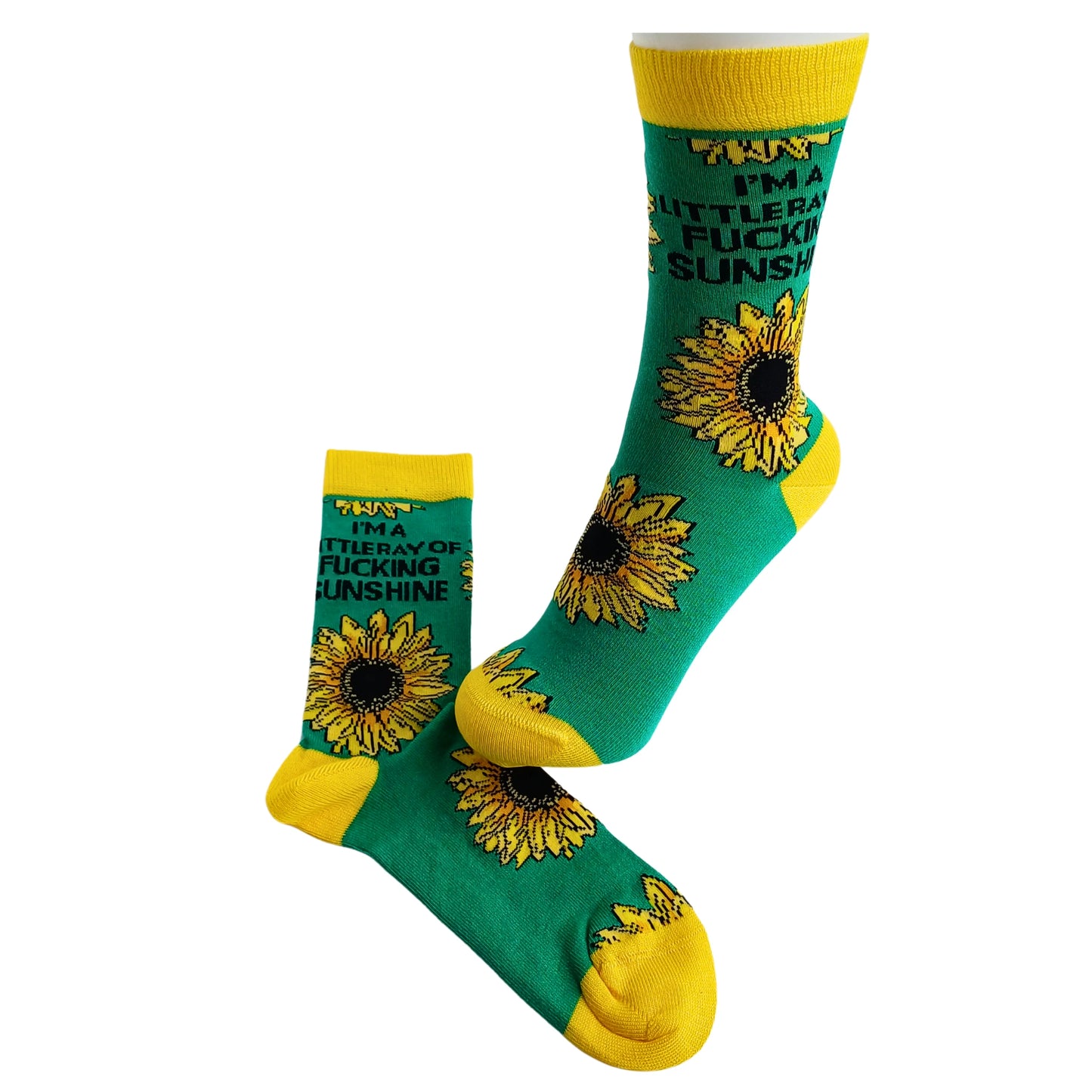 Funny sunflower socks with bold yellow trim on mannequin leg