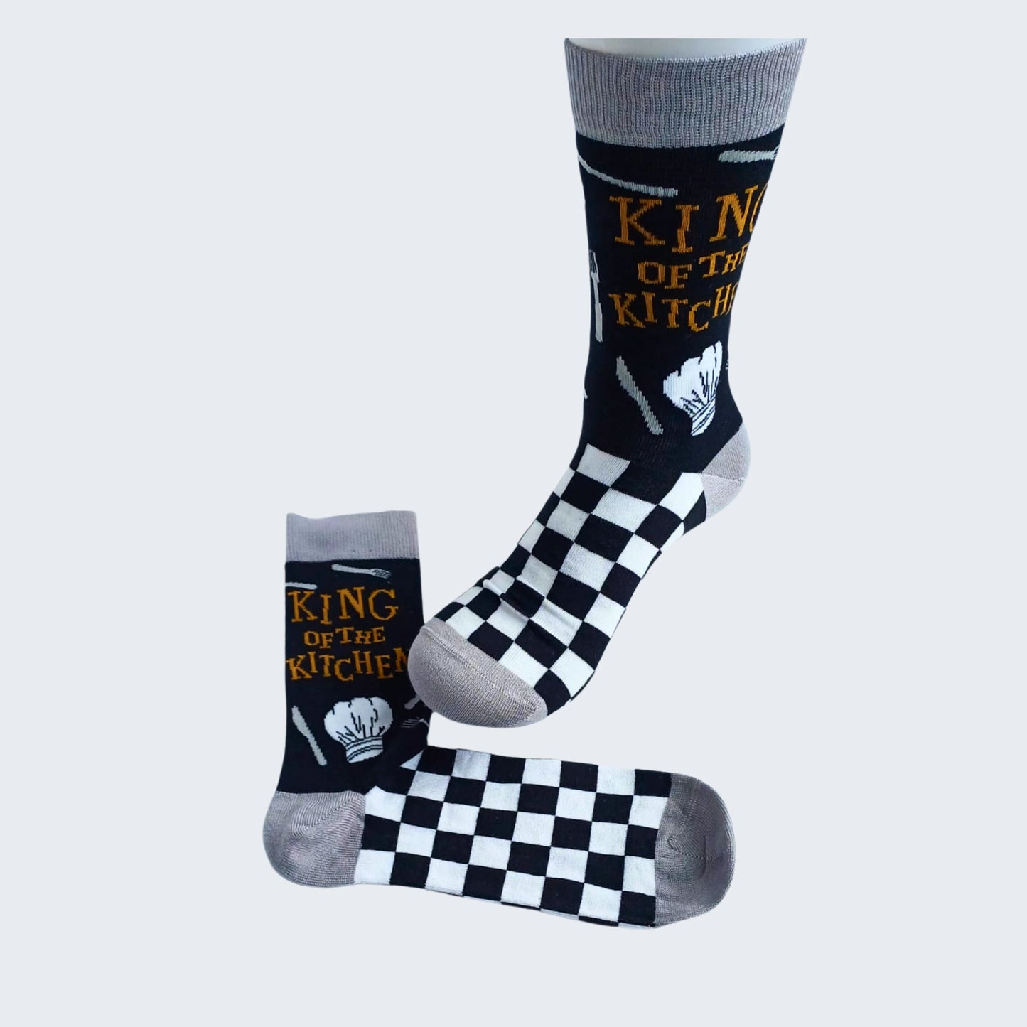 Displayed King of the Kitchen bamboo socks showing chef’s hat and checkerboard pattern